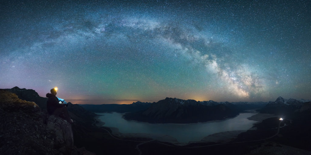 A panorama of the milky way above Abraham Lake in Mat from Vision Quest Mountain, Alberta, Canada