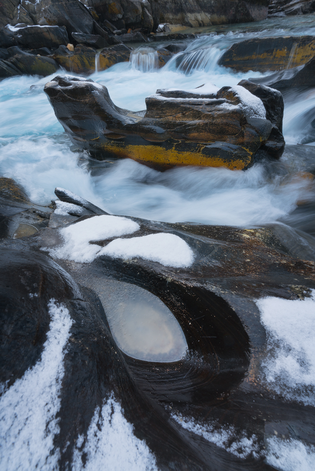 Patterns along the rivers edge at Numa Falls on a winter day, Kootenay National Park, British Columbia, Canada